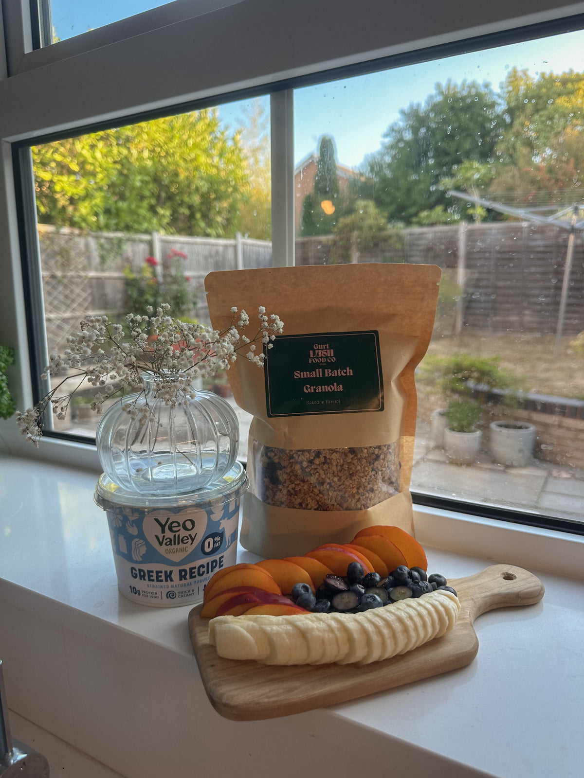 Crunchy Gurt Lush Food Co nut, seed, and sultana granola in a bowl with visible nuts, seeds, and dried sultanas.