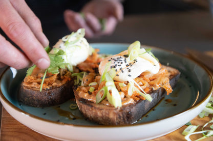 Fermented kimchi from Cultura Live Food in a glass jar, showing vibrant fermented vegetables with red pepper flakes and cabbage.