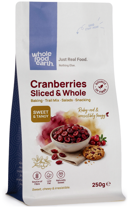 Dried cranberries, whole and sliced, from Whole Food Earth, shown in a clear container with vibrant red color and textured surface.