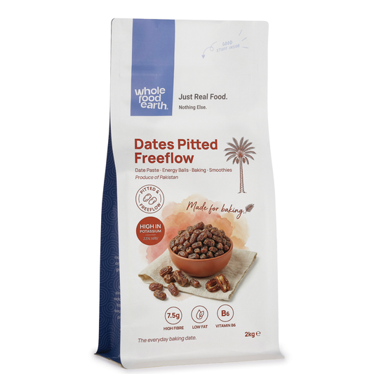 Pitted free-flow dried dates from Whole Food Earth, showing glossy, dark brown dates with smooth surfaces and natural texture.