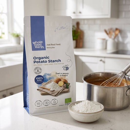 Whole Food Earth potato starch in a clear container, showing fine, white flour used for baking and gluten-free cooking.