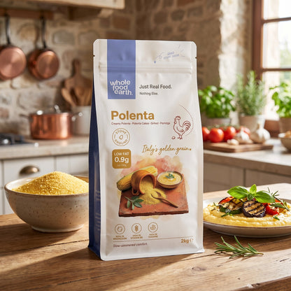 Whole Food Earth polenta in a bowl, showcasing its coarse yellow cornmeal texture, ideal for cooking and baking.