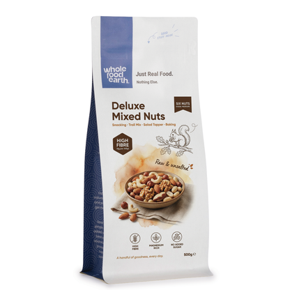 Mixed nuts in a bowl featuring Whole Food Earth Deluxe Mixed Nuts, including almonds, cashews, and walnuts.