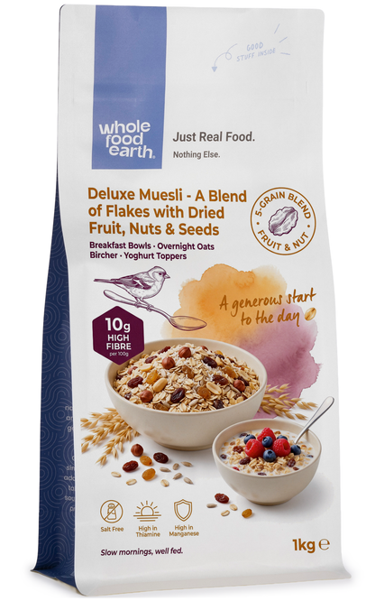 Whole Food Earth Deluxe Muesli cereal with flakes, dried fruit, nuts, and seeds in a colorful bowl.