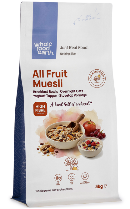 Whole Food Earth All Fruit Muesli cereal and granola in a bowl, featuring colorful dried fruits and oats.