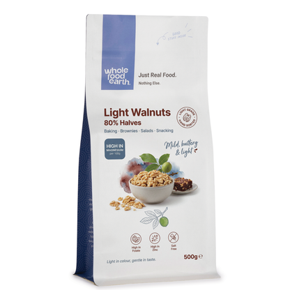 Light walnuts in 80% halves from Whole Food Earth, showcasing raw, natural nut halves in a clear container.