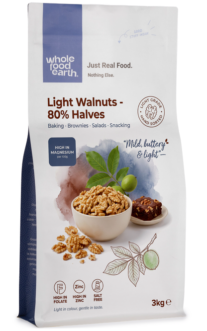 Whole Food Earth light walnuts in 80% halves, showing glossy, crunchy nut halves in a natural, close-up view.