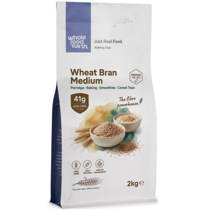 Whole Food Earth Wheat Bran Medium cereal in a bowl, showing light brown, textured wheat bran flakes on a white background.