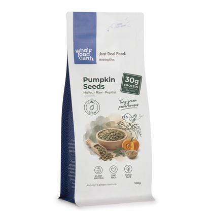 Whole Food Earth pumpkin seeds, raw nuts and seeds, displayed in a bowl against a neutral background.
