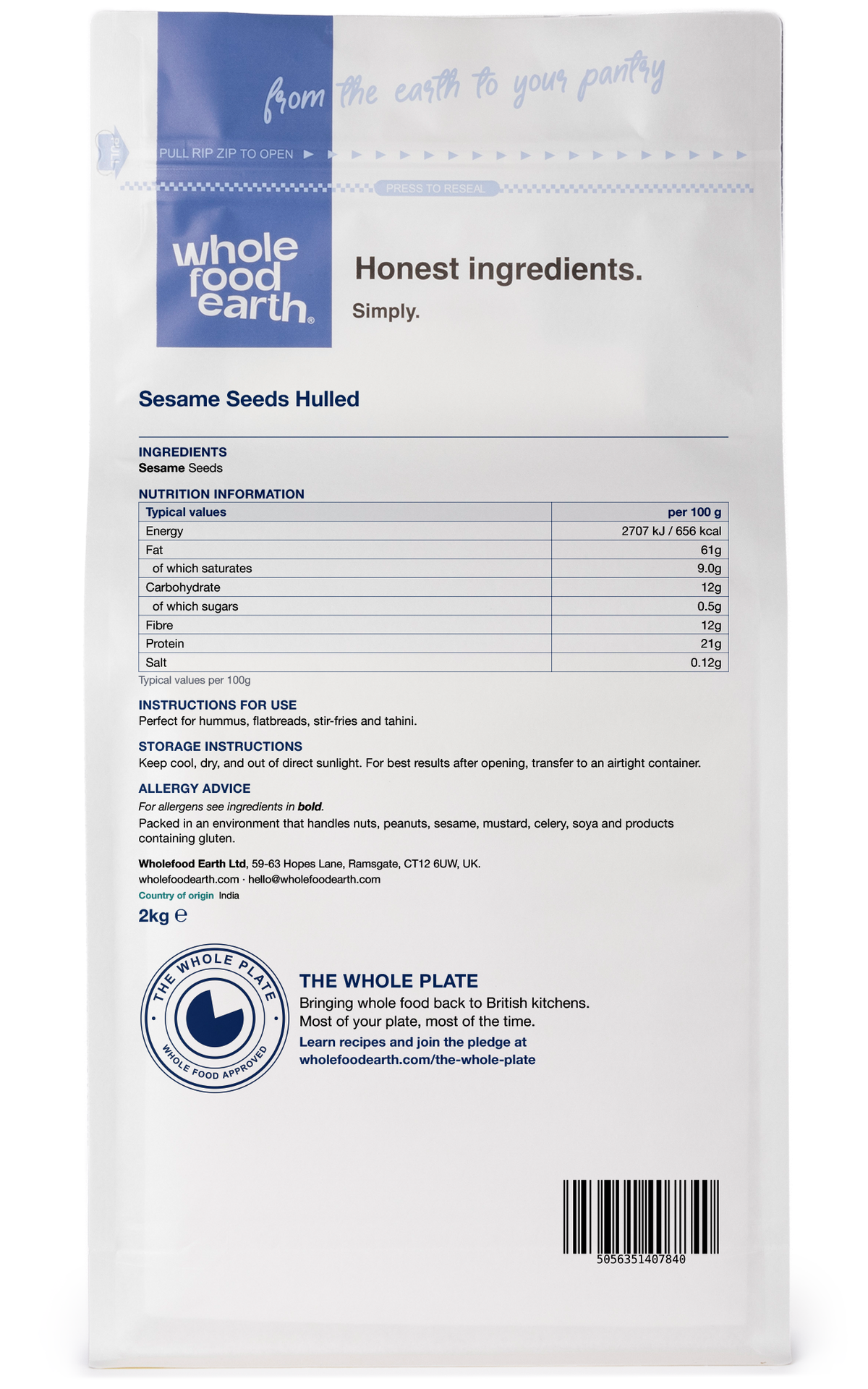 Hulled sesame seeds from Whole Food Earth, close-up of light tan seeds in a clear container, showcasing their smooth surface.