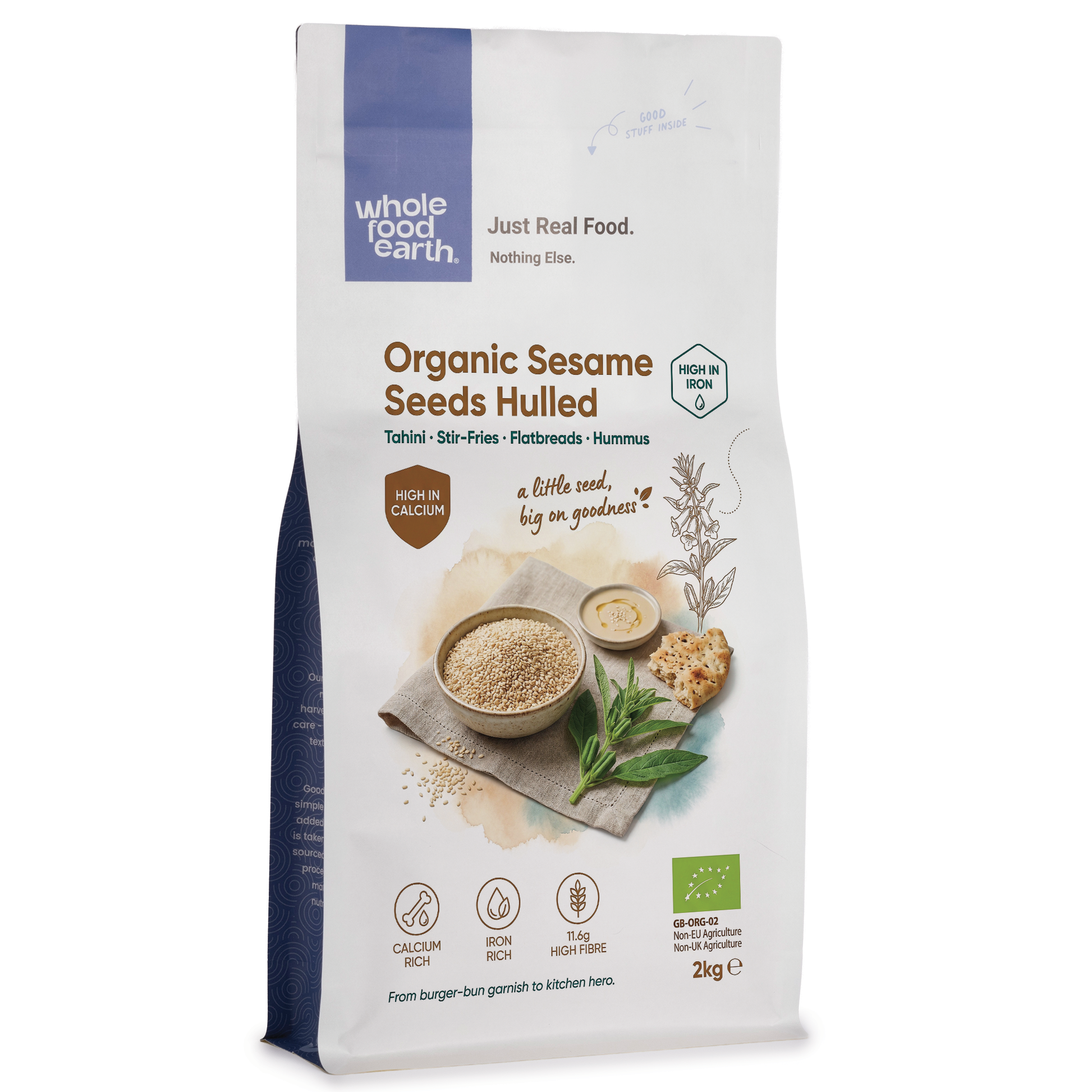 Whole Food Earth hulled sesame seeds in a clear bowl, showing small, light tan seeds used for cooking and baking.