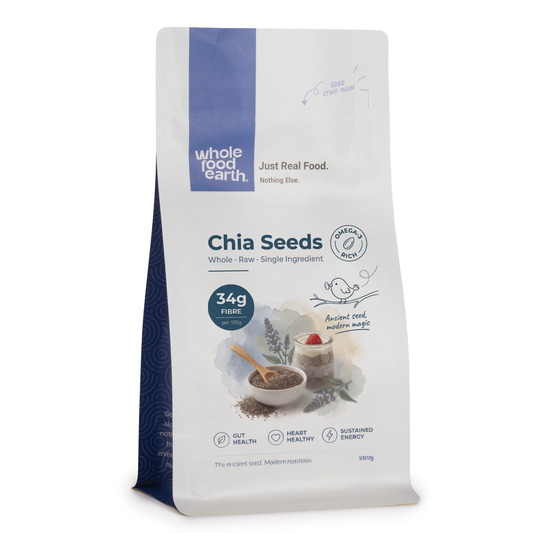Whole Food Earth chia seeds in a clear glass jar, showing small black and white seeds for nuts and seeds category.