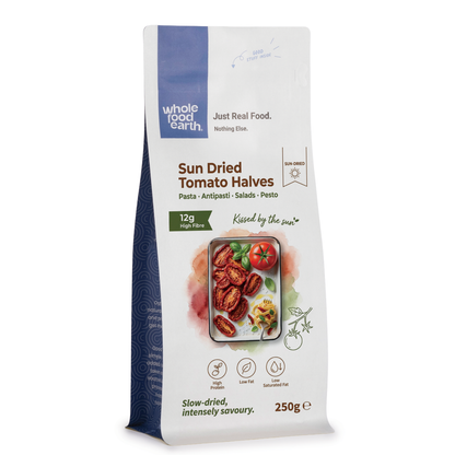 Whole Food Earth sun dried tomato halves in dried fruit packaging, showcasing vibrant red, chewy dried tomatoes.