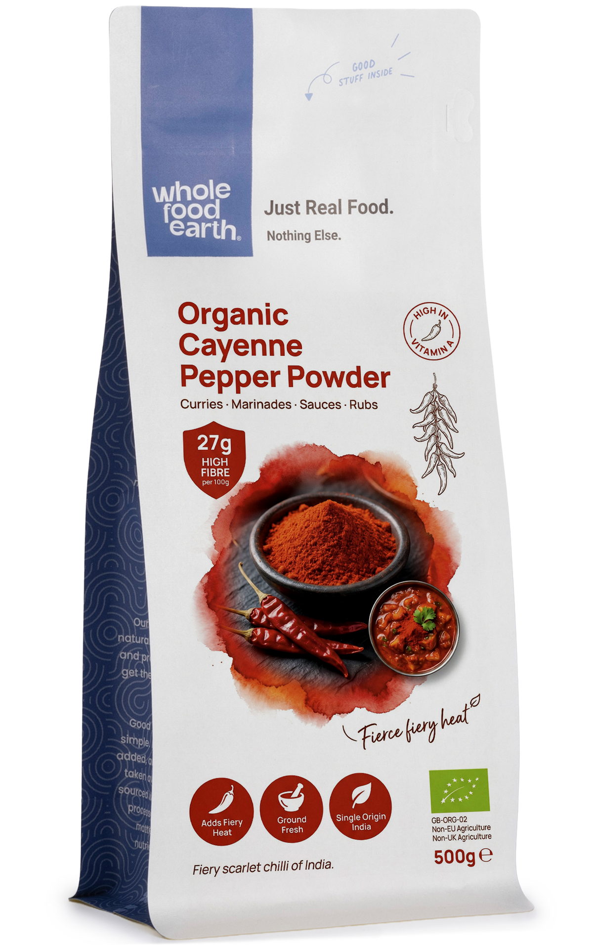 Organic cayenne pepper powder from Whole Food Earth, bright red ground spice in a clear container, ideal for cooking and seasoning.