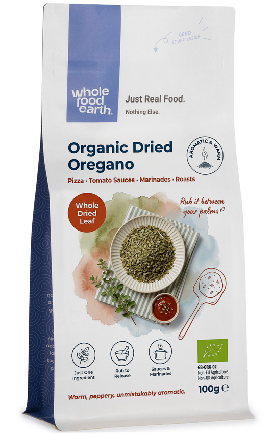 Dried organic oregano herb from Whole Food Earth, close-up of green oregano leaves in a jar for herbs and spices.