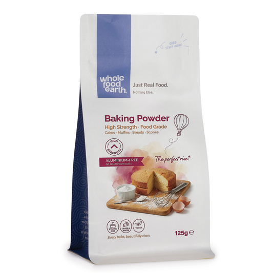 Whole Food Earth high strength baking powder in a mineral and salts container, with a white label and black cap.