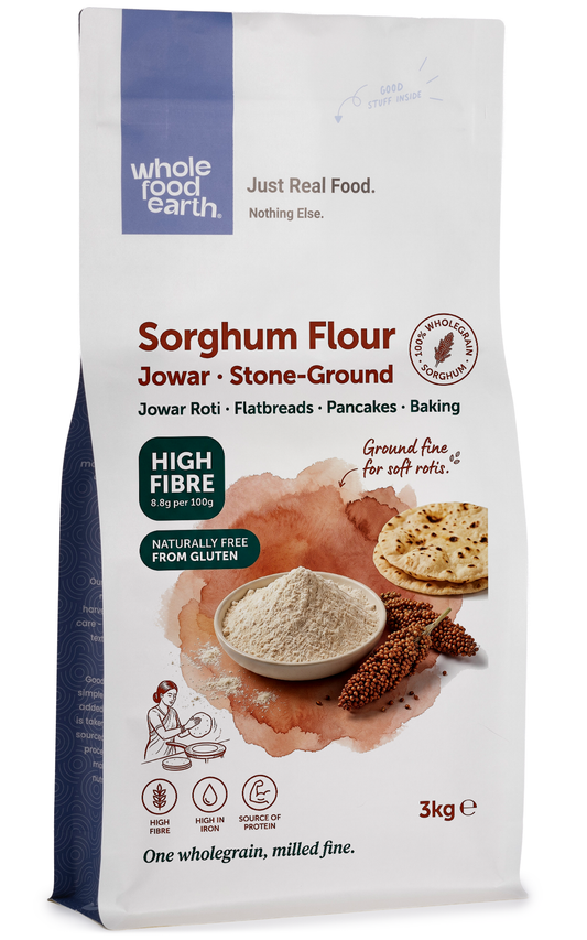 Whole Food Earth sorghum flour in a clear bag, showing light tan, fine grain texture, and label with product details.