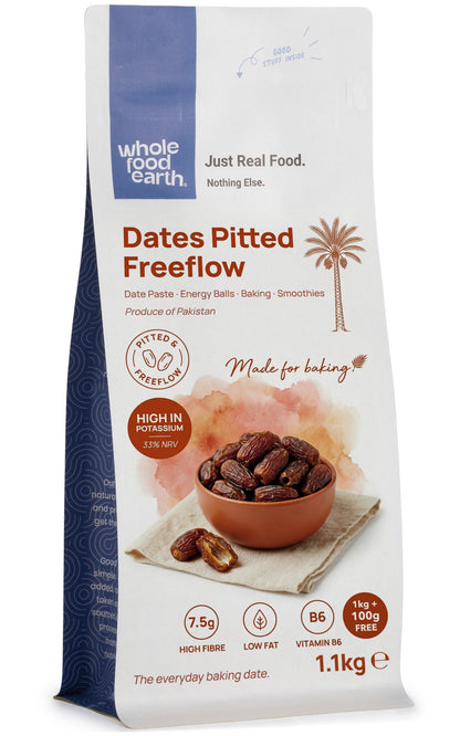 Pitted dates from Whole Food Earth, dried fruit in a clear container, showing glossy, dark brown dates ready to eat.