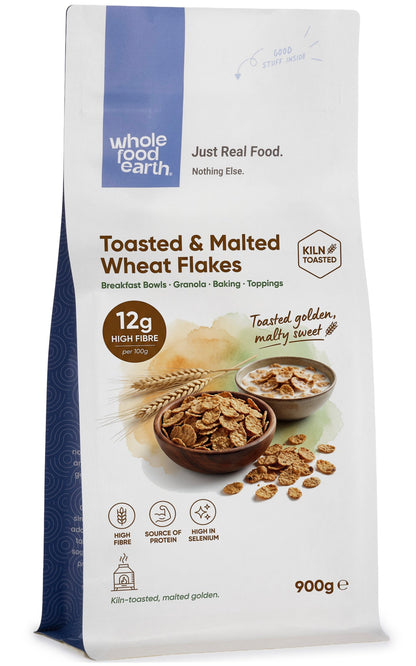 Whole Food Earth toasted and malted wheat flakes cereal in a bowl, showing golden-brown crispy wheat flakes.