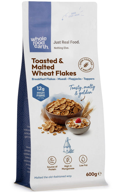 Whole Food Earth toasted and malted wheat flakes cereal in a bowl, close-up view showing crispy golden wheat flakes.