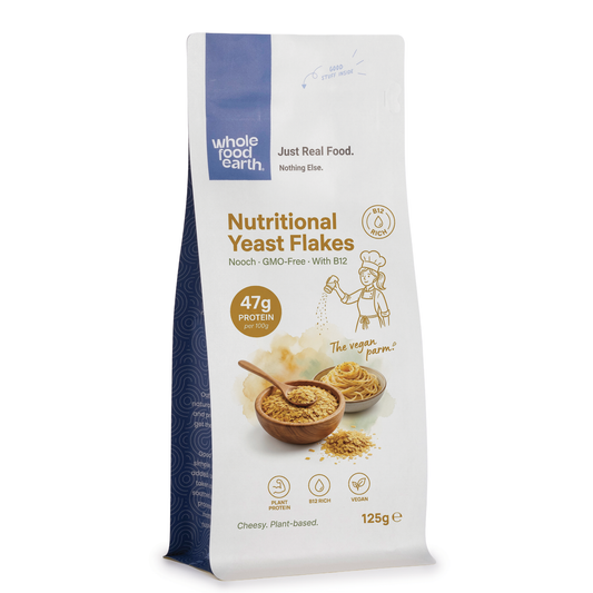 Whole Food Earth nutritional yeast flakes with B12, a natural supplement from nuts and seeds, shown in a clear package.