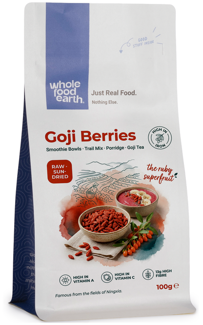 Dried goji berries in a clear bowl, showcasing vibrant red-orange color, from Whole Food Earth dried fruits collection.