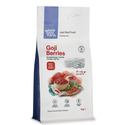 Dried goji berries from Whole Food Earth, natural red-orange dried fruits with small oval shapes, on a white background.