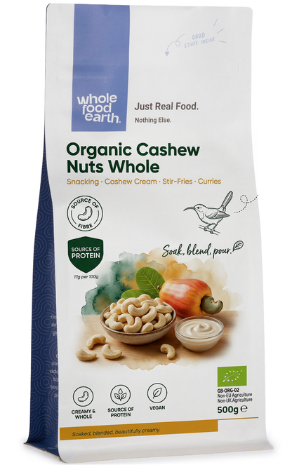 Whole Food Earth organic whole cashew nuts, natural and unroasted, in a clear container, showcasing their creamy, curved shape.