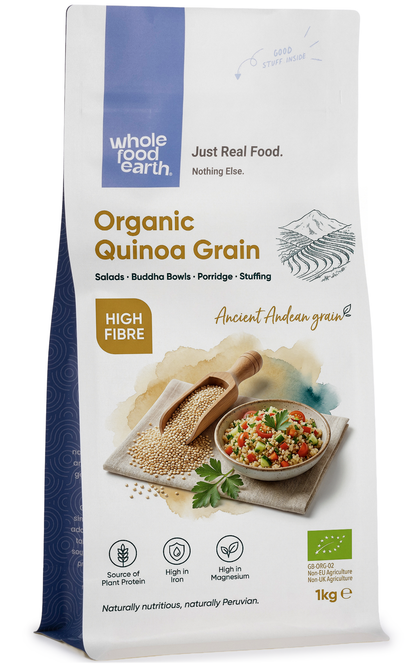 Organic Whole Food Earth quinoa grains in a clear jar, showcasing small, round, beige quinoa seeds on a neutral background.