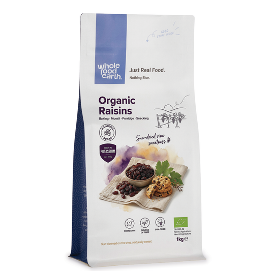Organic raisins from Whole Food Earth, dried fruit with plump, glossy appearance in a close-up shot.