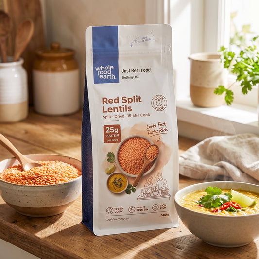 Organic red split lentils from ArtisanBox, showing a close-up of vibrant red lentils in a bowl.