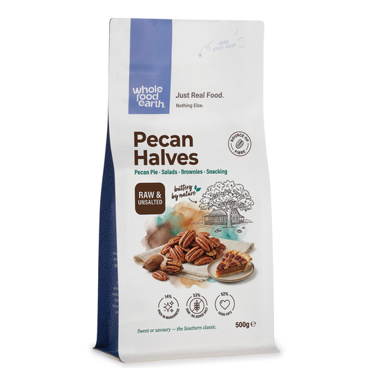 Whole Food Earth pecan halves, crunchy nuts and seeds in a close-up view, showcasing their natural texture and rich brown color.