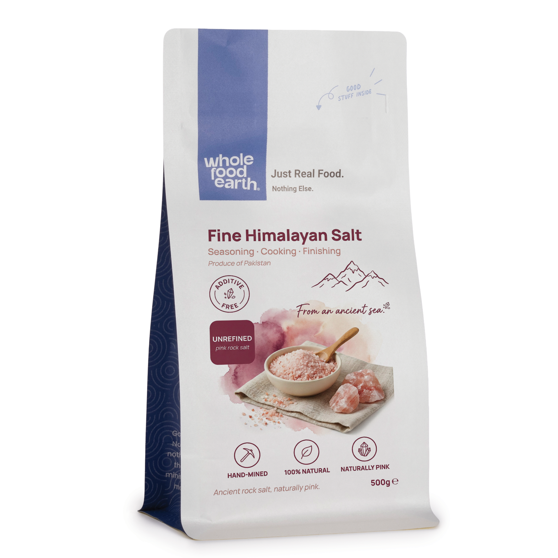 Crystals of Whole Food Earth Fine Himalayan Salt, pink mineral salt for culinary and health uses, close-up image.