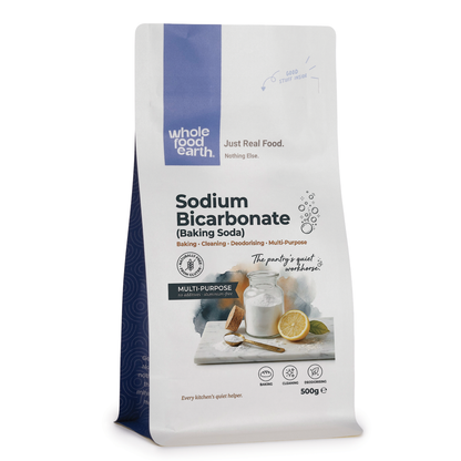 Container of Whole Food Earth sodium bicarbonate baking soda, natural mineral salt in a clear jar with a white label.