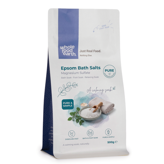 Whole Food Earth Epsom Bath Salts minerals and salts in a clear container, perfect for relaxing bath routines.