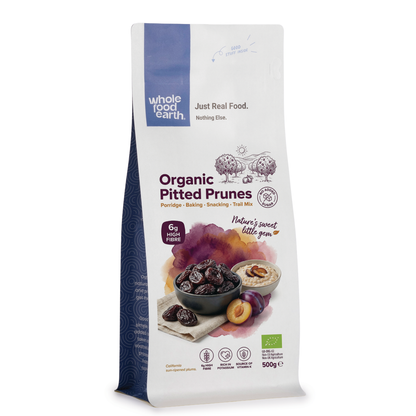 Organic pitted prunes from Whole Food Earth, dried fruits, showing glossy, dark purple prunes with smooth surfaces.