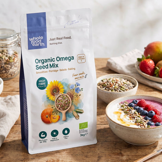 Organic Omega seed mix from Whole Food Earth featuring a colorful blend of nutritious nuts and seeds in a resealable bag.