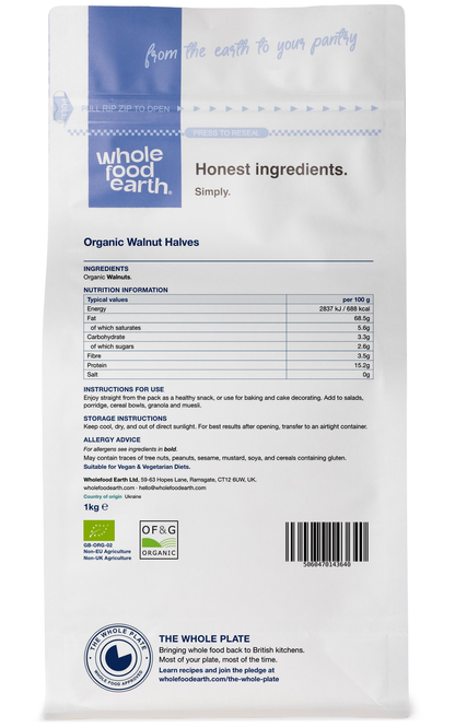 Back view of Whole Food Earth organic walnut halves in a clear container, showcasing their natural, crunchy texture and rich color.
