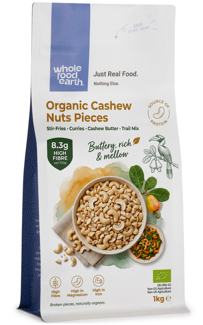 Organic cashew nut pieces from Whole Food Earth, showing a close-up of creamy, crunchy nut pieces in a natural setting.