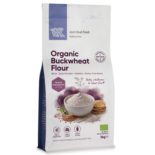 Organic buckwheat flour from Serious Grains in a natural paper bag, showcasing the light brown, finely ground flour for baking.