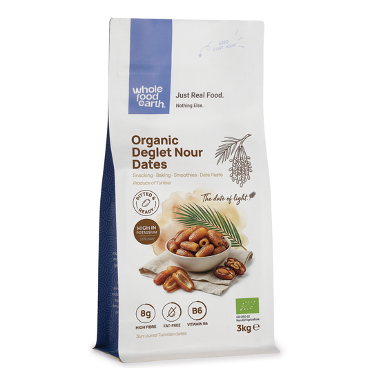 Organic Deglet Nour pitted dates from Whole Food Earth, dried fruit with glossy, amber-colored, and moist texture.