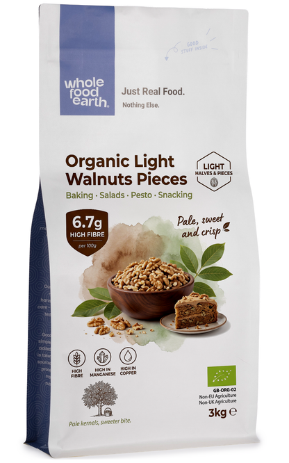 Raw organic light walnut pieces from Whole Food Earth, showcasing crunchy, light-colored walnut halves and pieces for snacking or baking.