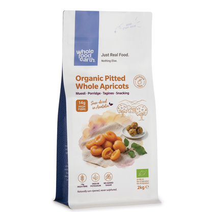 Organic pitted whole apricots from Whole Food Earth, dried fruit with rich orange color and smooth texture.