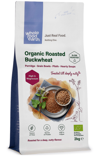 Organic roasted buckwheat grains from Whole Food Earth, displayed in a clear bowl with a rustic background.