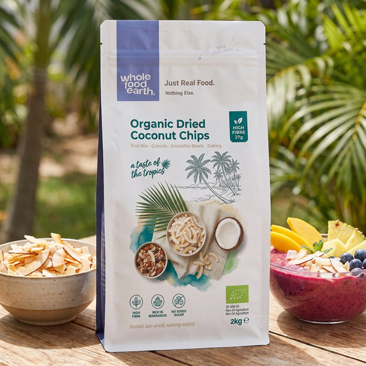 Organic dried coconut chips by ArtisanBox, showing crispy, shredded coconut pieces in a natural, textured appearance.