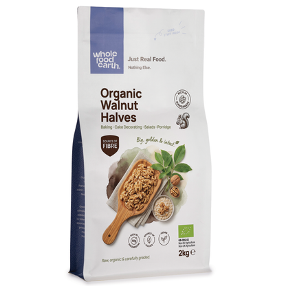 Whole Food Earth organic walnut halves, fresh and crunchy nuts and seeds in a close-up image.