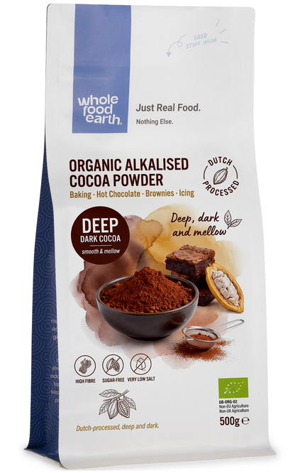 Organic alkalised cocoa powder from Whole Food Earth, showing a bowl of rich, dark brown cocoa powder on a wooden surface.