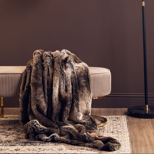 Orsina Bosie mocha ombre fur throw, draped over a chair with soft gradient texture visible