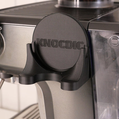 KNOCDIC® magnetic universal portafilter holder for 51mm, 54mm, and 58mm portafilters, securely holding coffee portafilters in place.