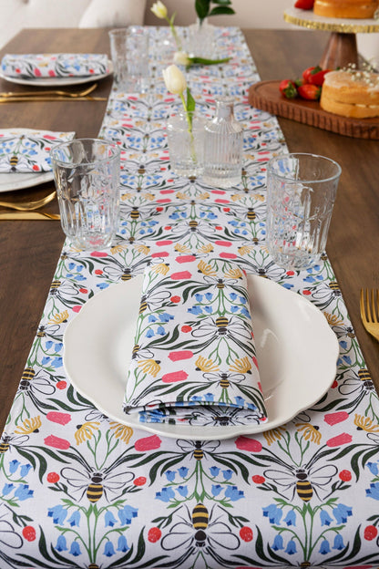 British Bees table runner by Avalon Home UK featuring a bee pattern, displayed from a side view on a wooden table.